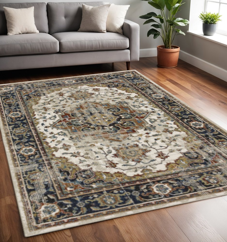 5' X 7' Beige Blue Green Rust And Grey Oriental Power Loom Stain Resistant Area Rug