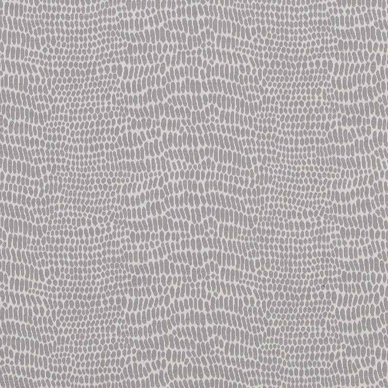 Gray snakeskin-inspired pattern with small rounded scales on neutral upholstery fabric.
