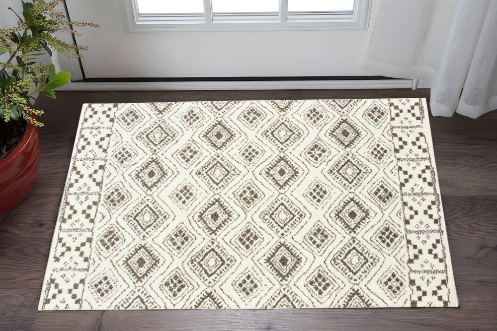2' X 3' Ivory And Brown Geometric Shag Power Loom Stain Resistant Area Rug