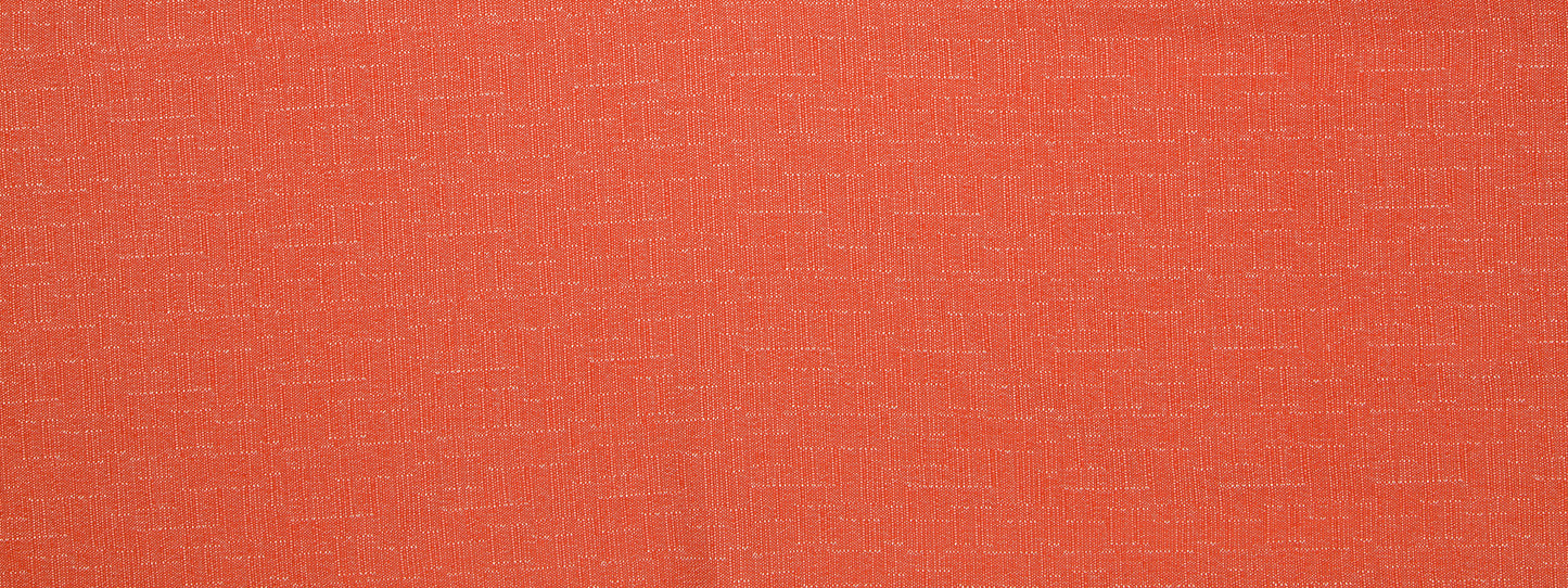 Close-up of orange-red plush upholstery fabric with a soft, textured surface.