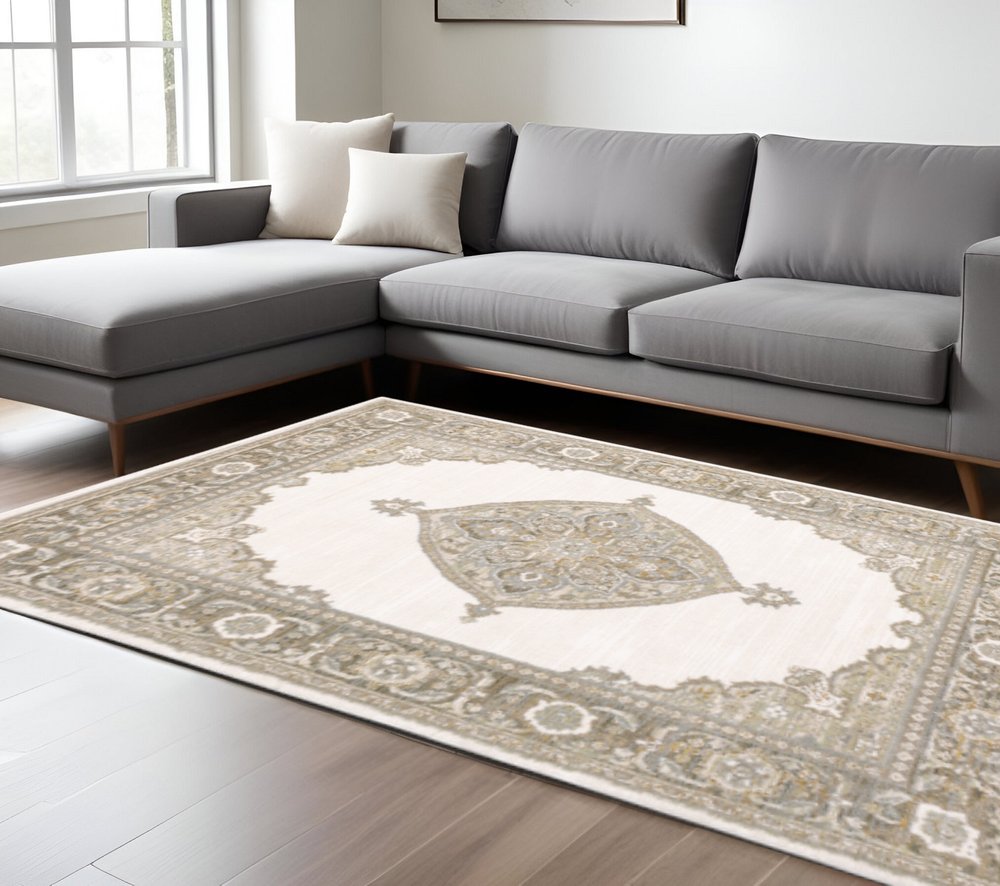 8' X 11' Beige and Ivory Oriental Power Loom Area Rug