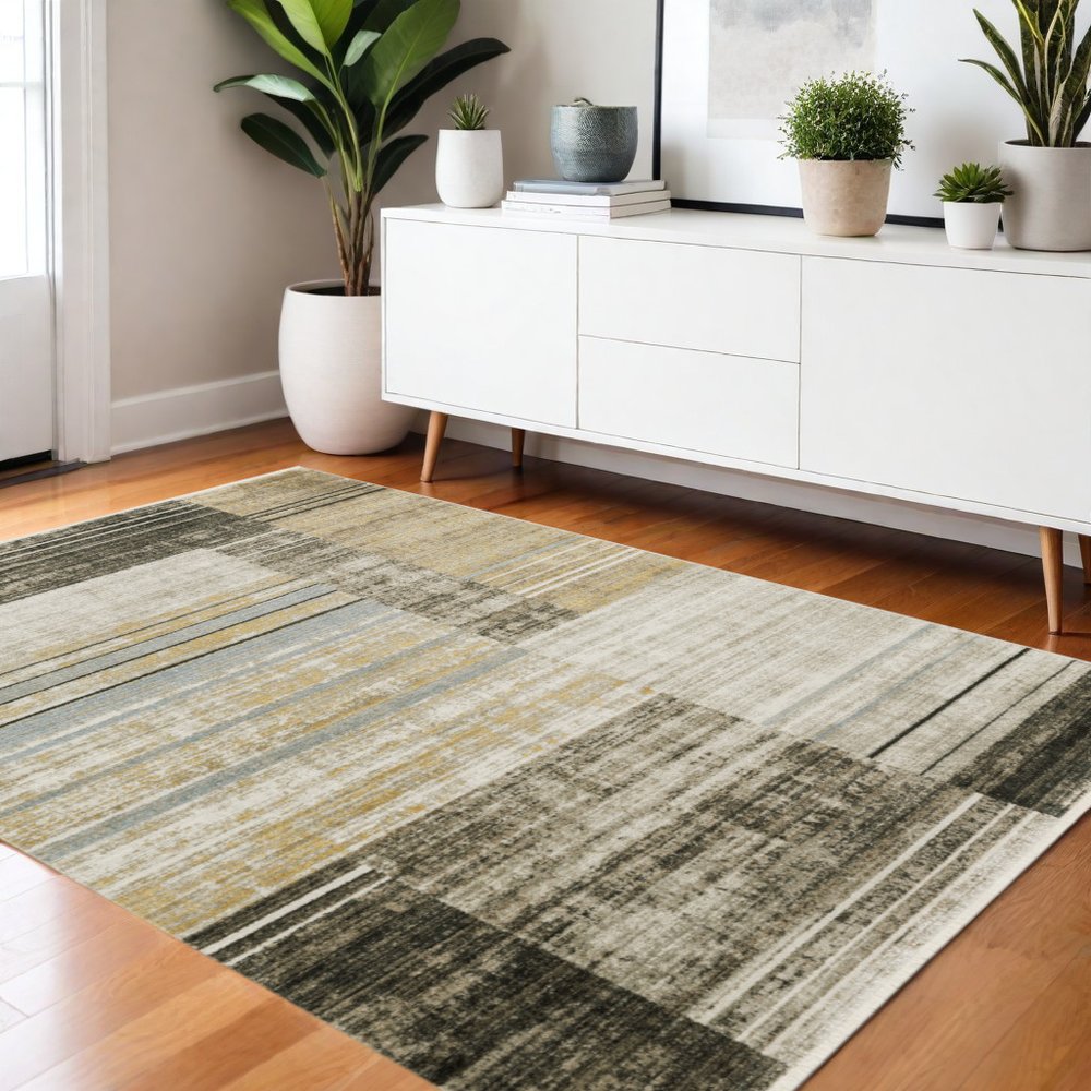 4' X 6' Beige Charcoal Brown Grey Tan Gold And Blue Geometric Power Loom Stain Resistant Area Rug With Fringe