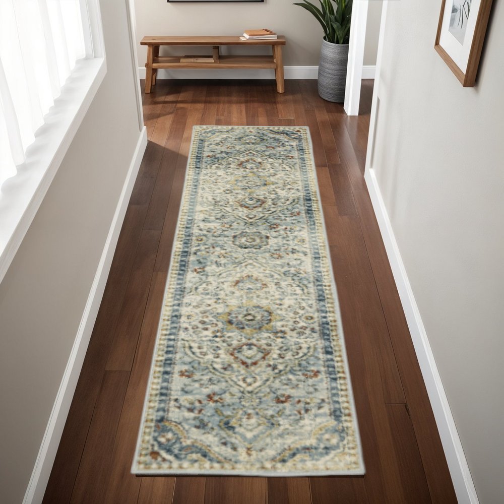 2' x 8' blue beige rust gold and teal oriental power loom runner rug with stain resistant finish.