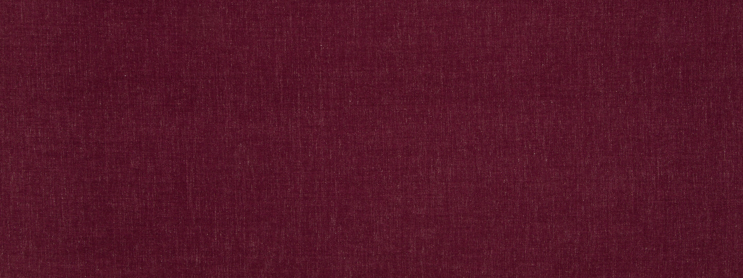 Close-up of deep burgundy fabric with subtle woven texture.