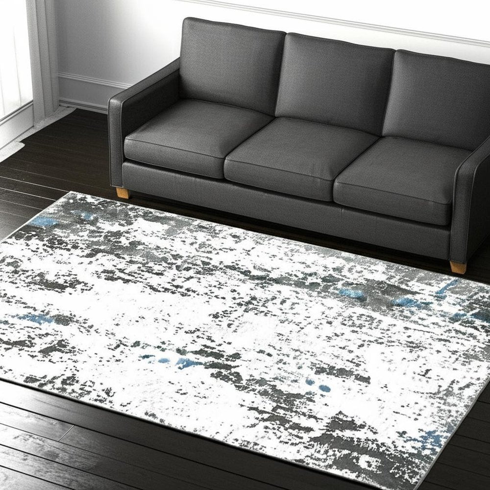 5' X 7' Silver Grey Charcoal And Light Blue Abstract Printed Stain Resistant Non Skid Area Rug