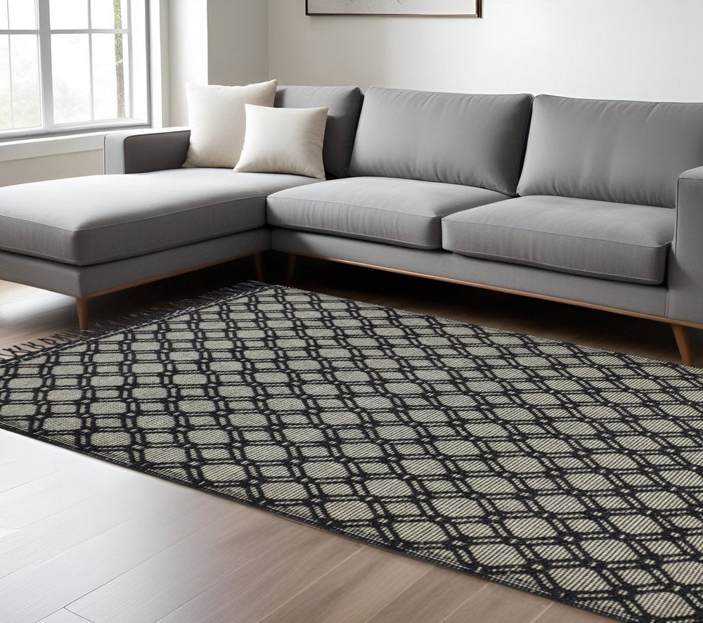 5' X 8' Black And Ivory Wool Geometric Hand Woven Area Rug With Fringe