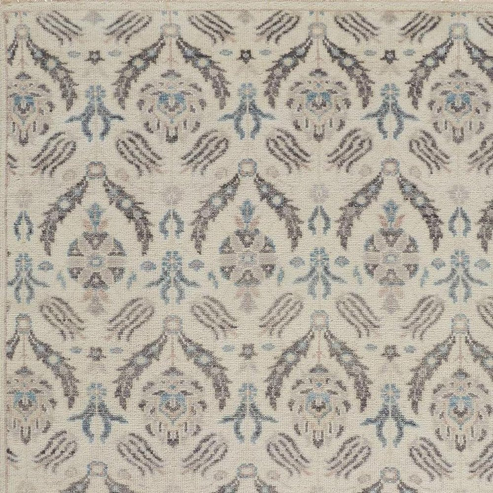 5' X 8' Gray and Ivory Wool Floral Hand Knotted Area Rug