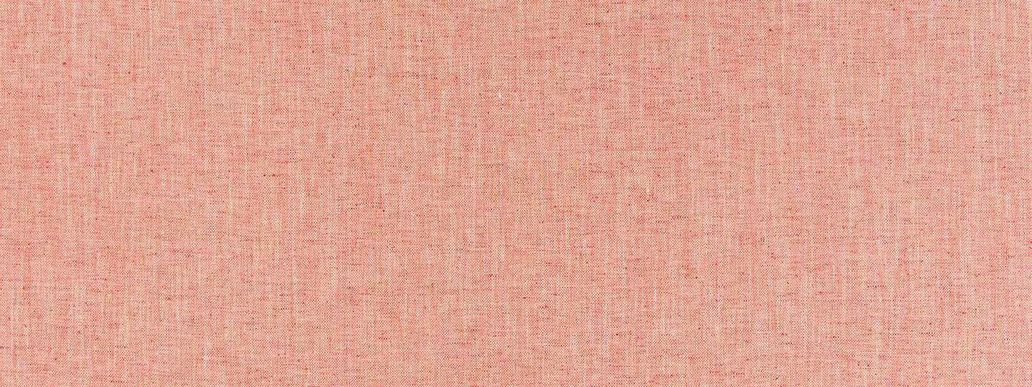 Peach pink woven fabric texture with visible weave; soft, breathable material for apparel or home decor.