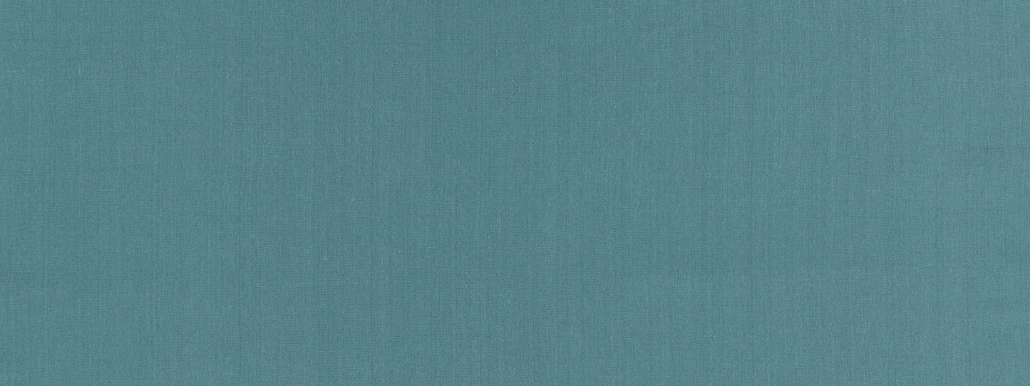 Teal textured fabric backdrop with a subtle weave.