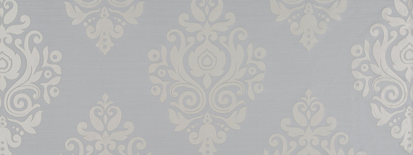 Blue-gray damask motif in a silver frame; vintage, elegant wall decor.