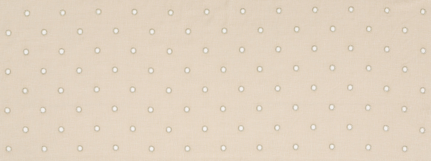 Beige textured drapery fabric with tiny white polka dots in a subtle grid pattern.