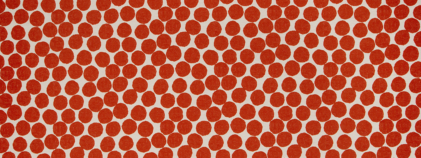 Close-up of orange polka dots on white background; bold, evenly spaced circular pattern.