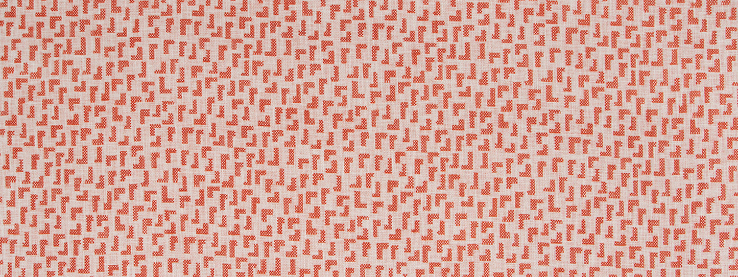 Red geometric print on pale pink fabric with tiny L-shaped motifs in a repeating pattern.