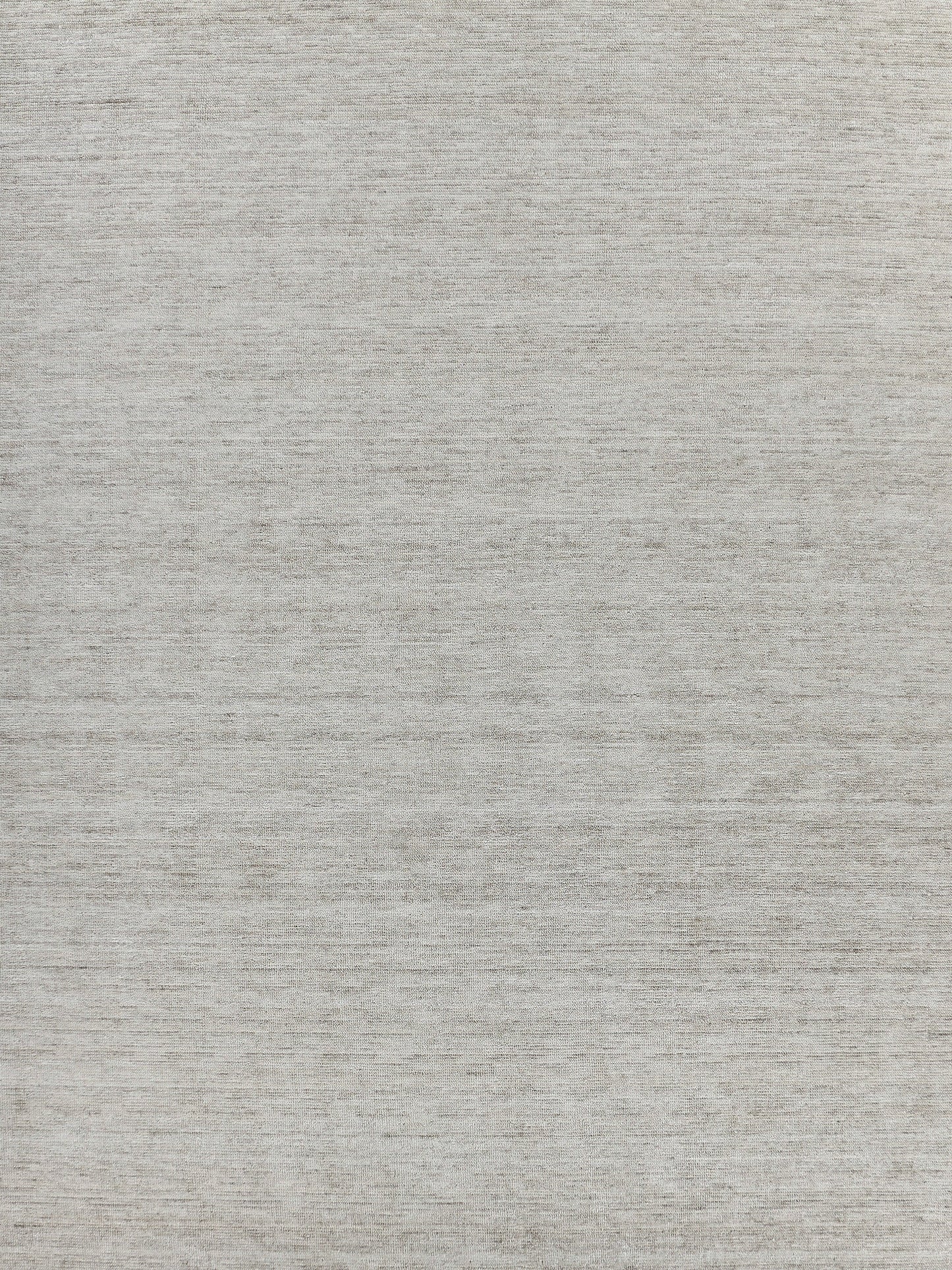 Light gray handloomed rug, rectangle 6x9 ft, with a soft, textured surface.