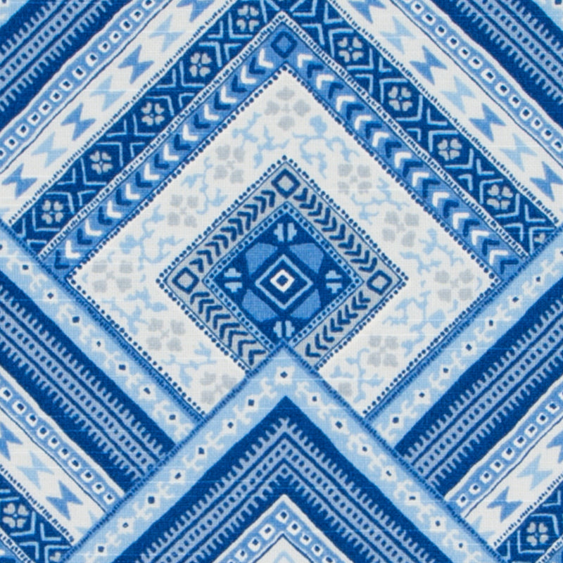 Blue and white geometric textile with diamond square motifs and borders; versatile boho throw or scarf.