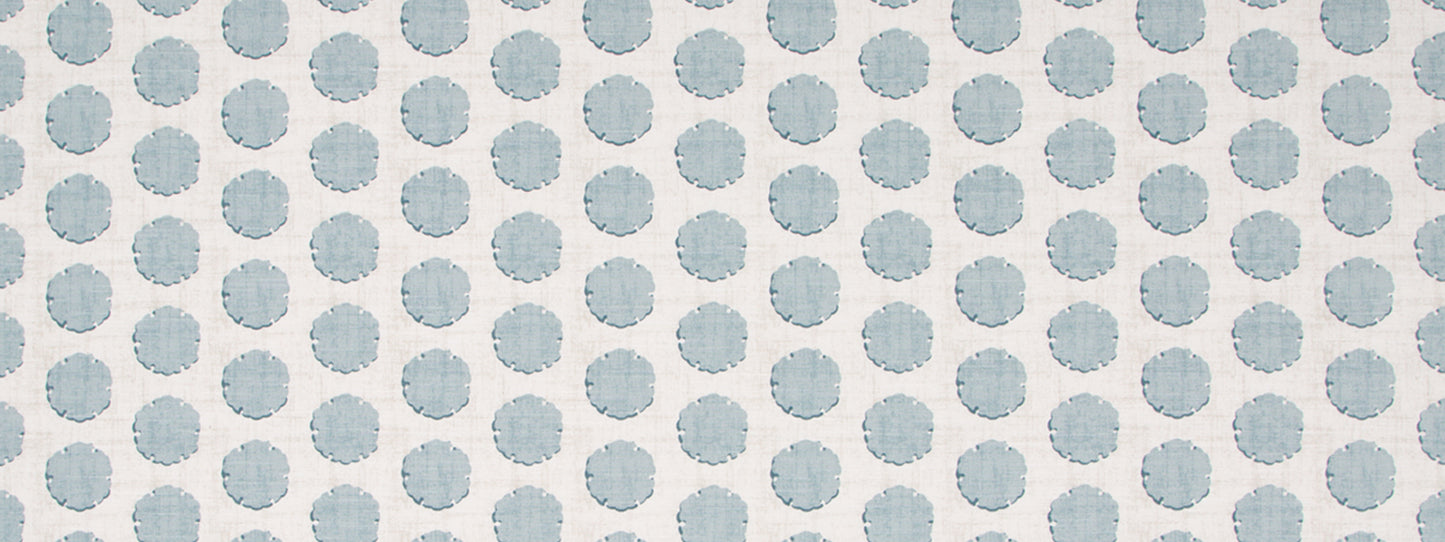 Blue-gray polka dot fabric pattern with evenly spaced circles on a white background.