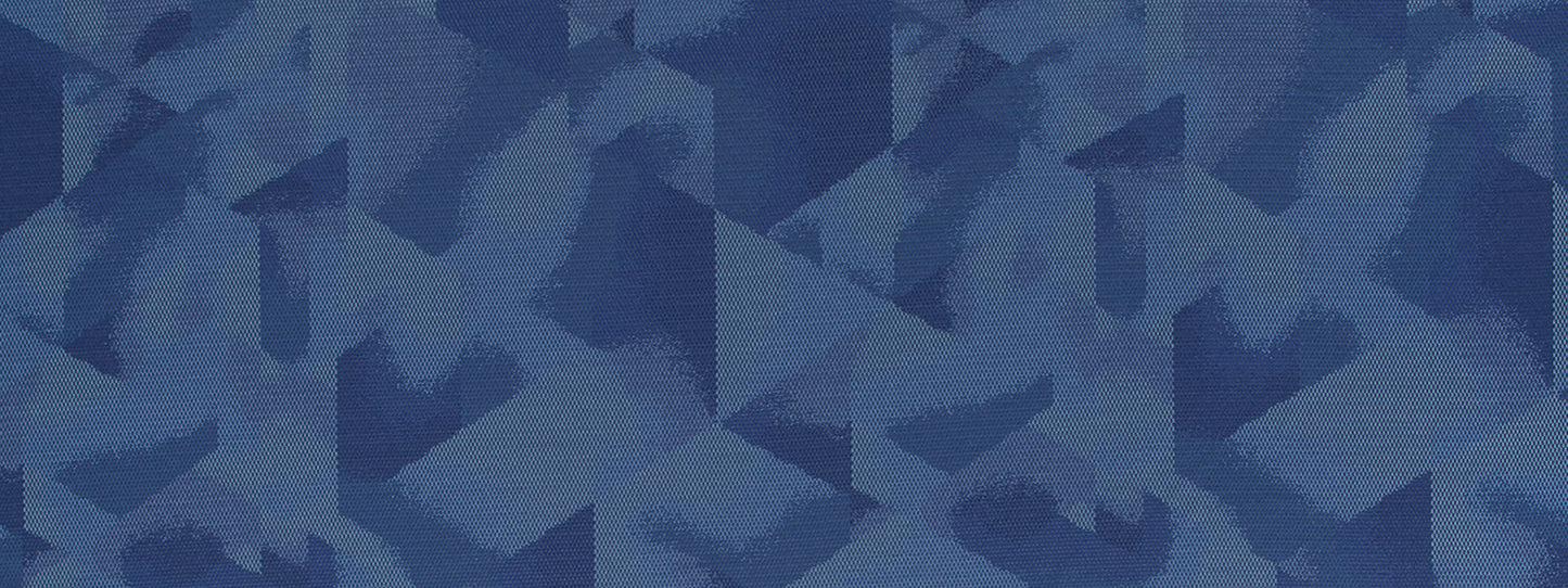 Blue denim camouflage fabric texture with irregular brush-stroke shapes.