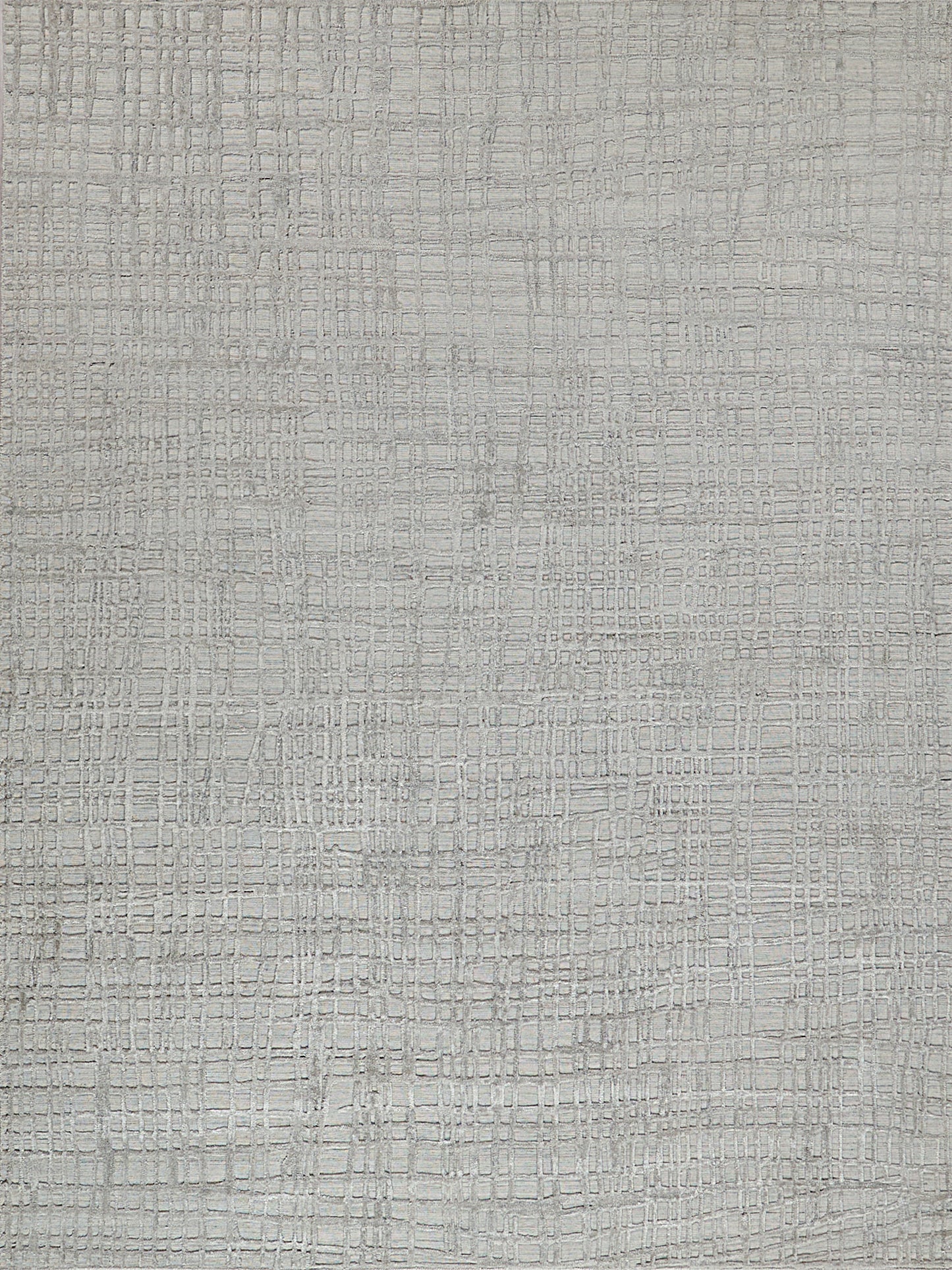 Textured light gray rug with a subtle crocodile-skin pattern.