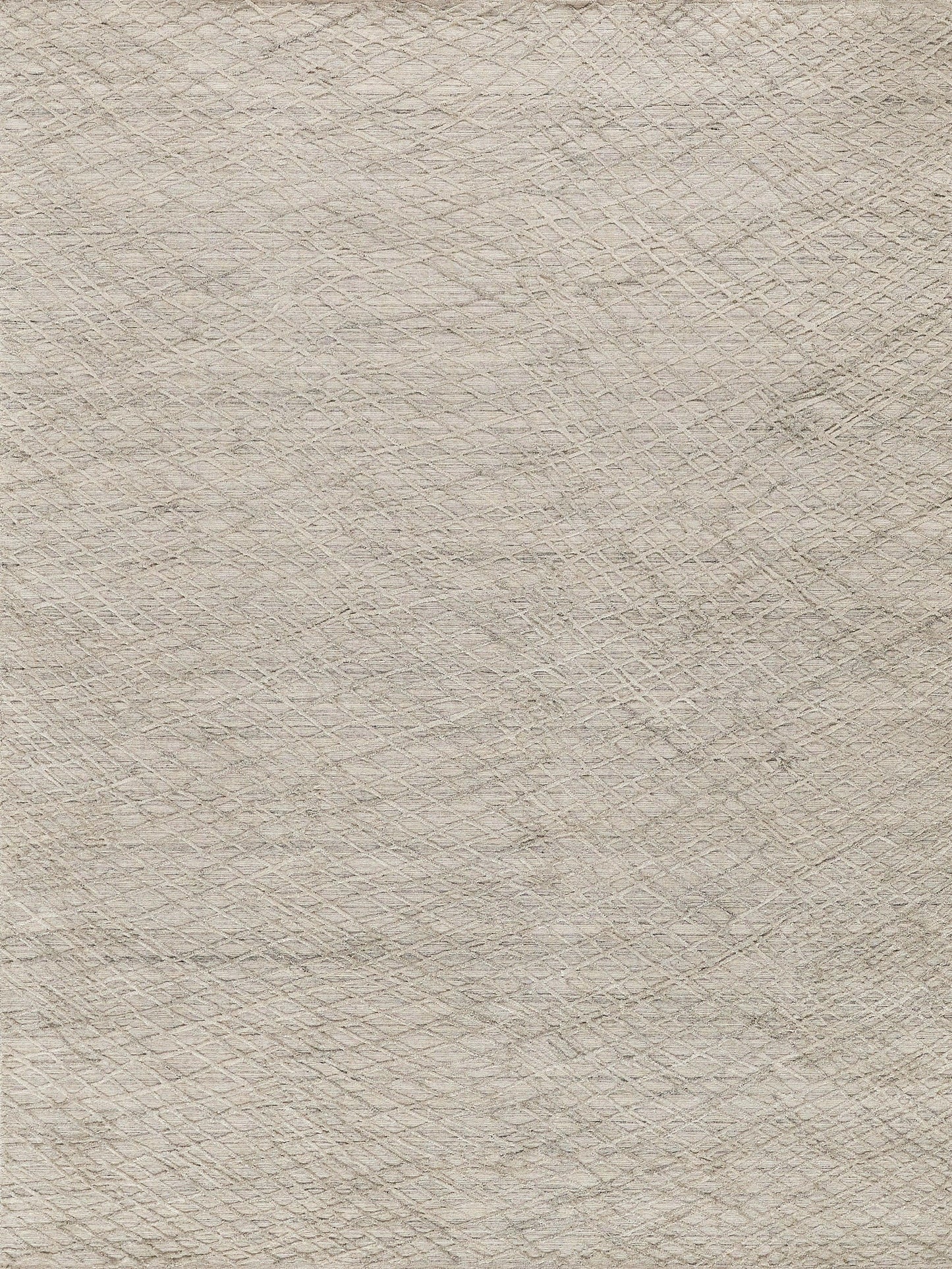 Beige hand-loomed woven rug with subtle diamond lattice texture in soft neutral tones for a casual living space.