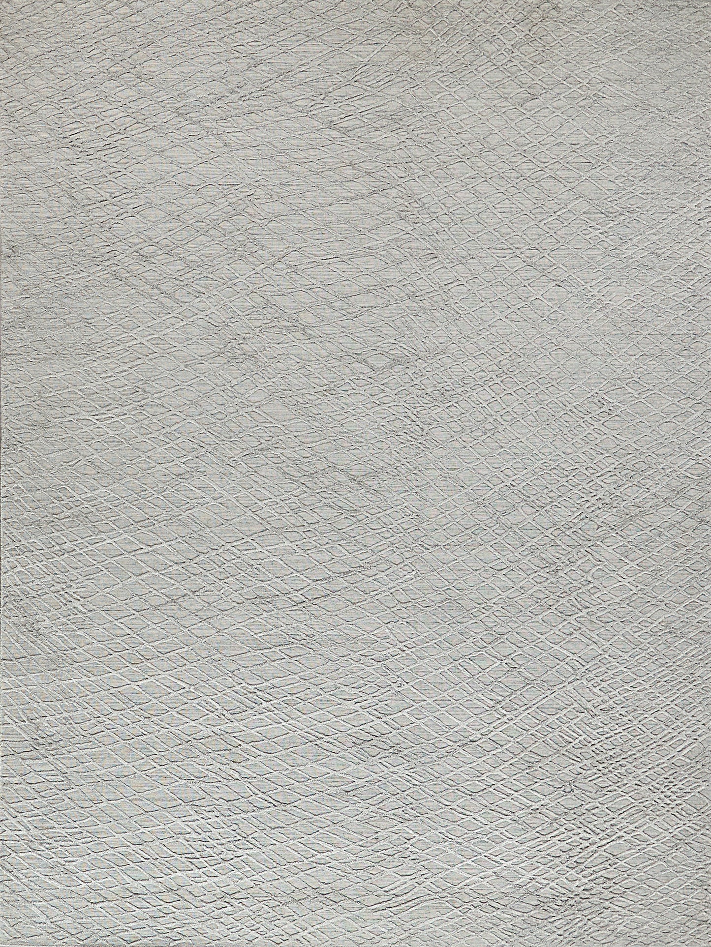 Light gray handloomed rug with a subtle crosshatch texture.