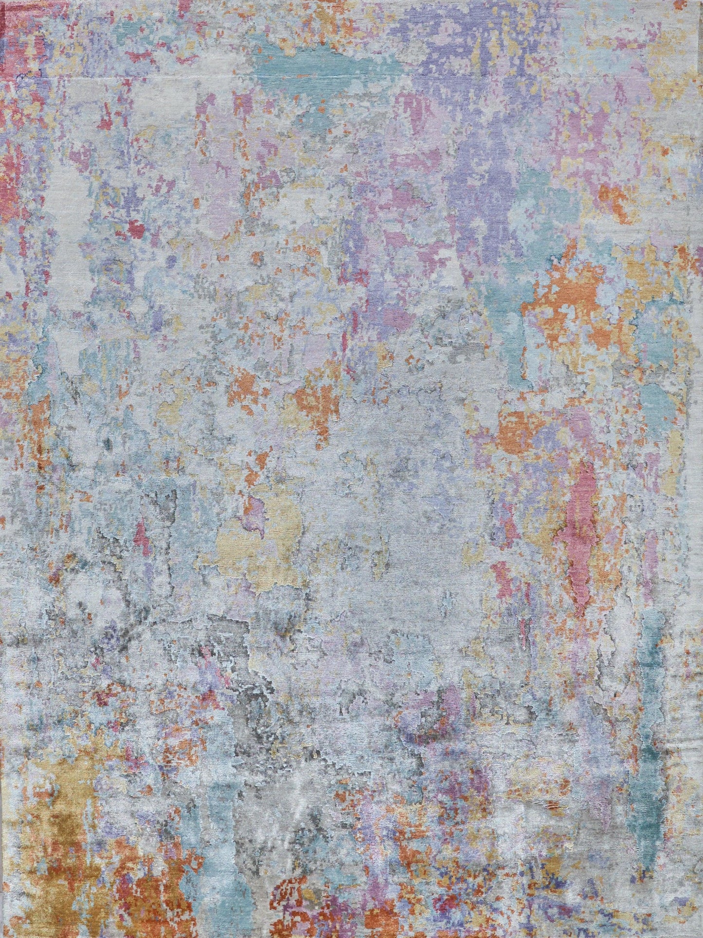 Colorful abstract area rug with a blend of pastel hues like pink, blue, and yellow, featuring a textured, distressed pattern.