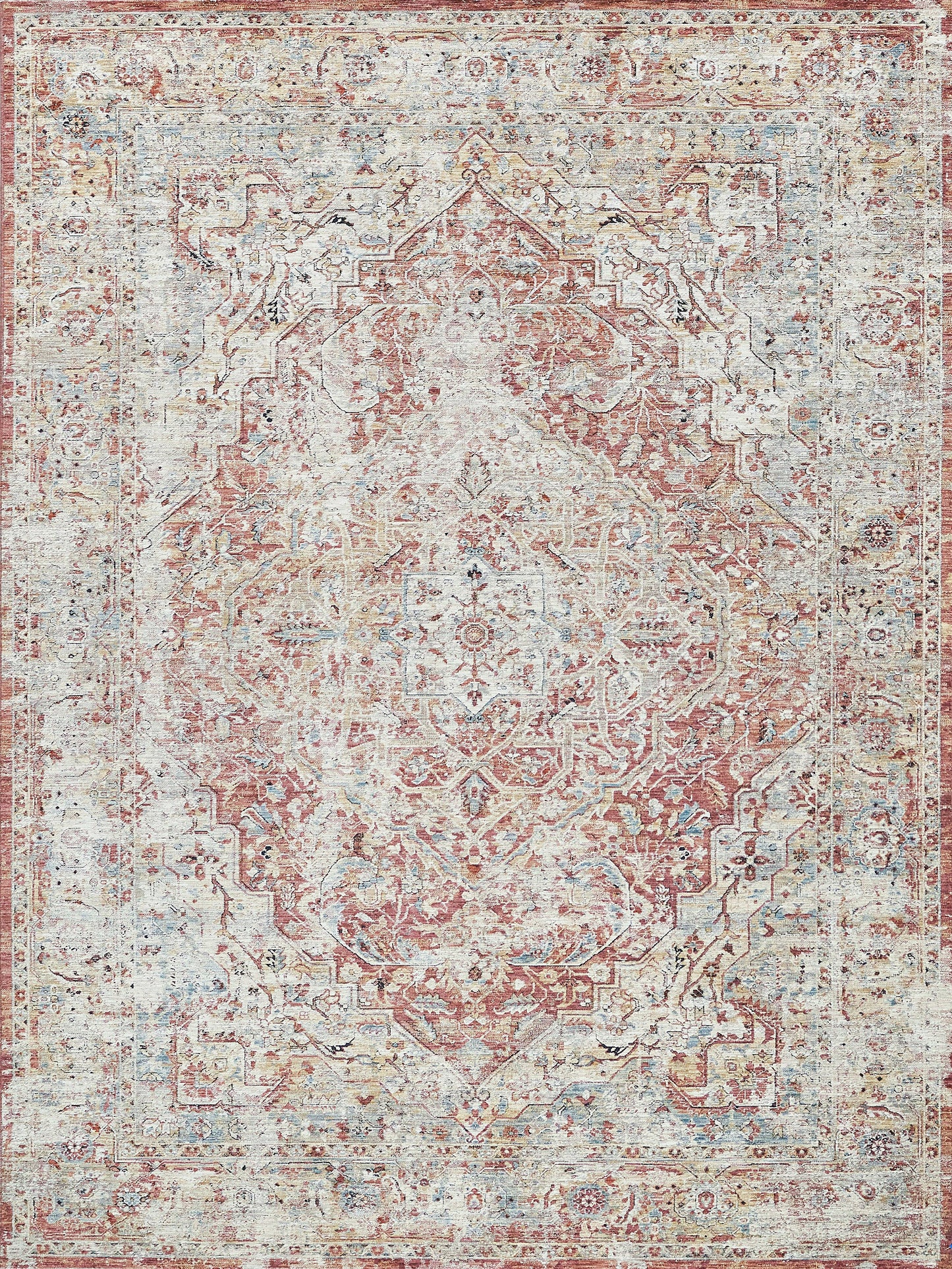 Distressed oriental rug in dusty pink, ivory and pale blue with an intricate central medallion and floral border.