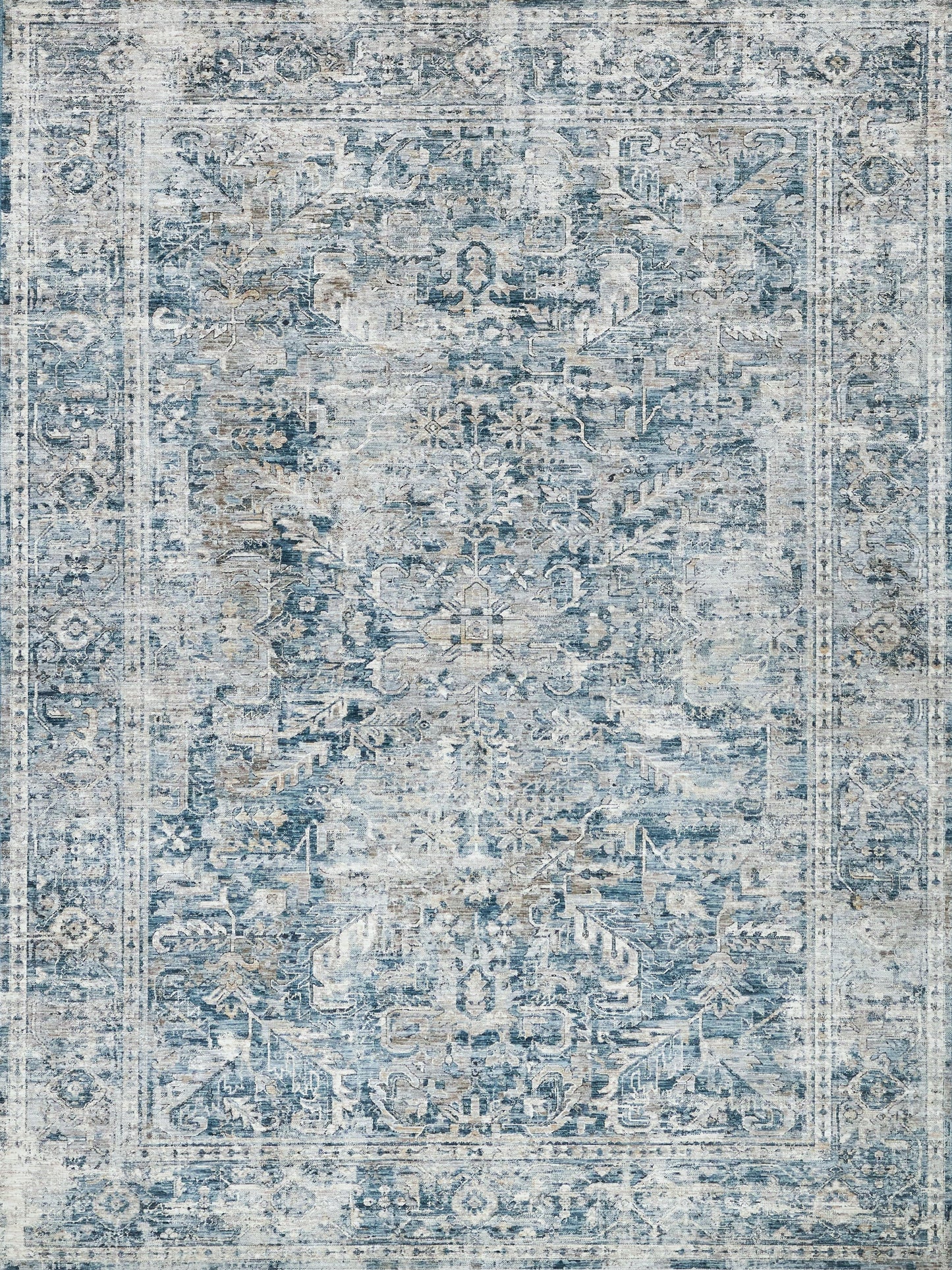Distressed blue and ivory oriental rug with central medallion, floral motifs and ornate border for traditional decor.