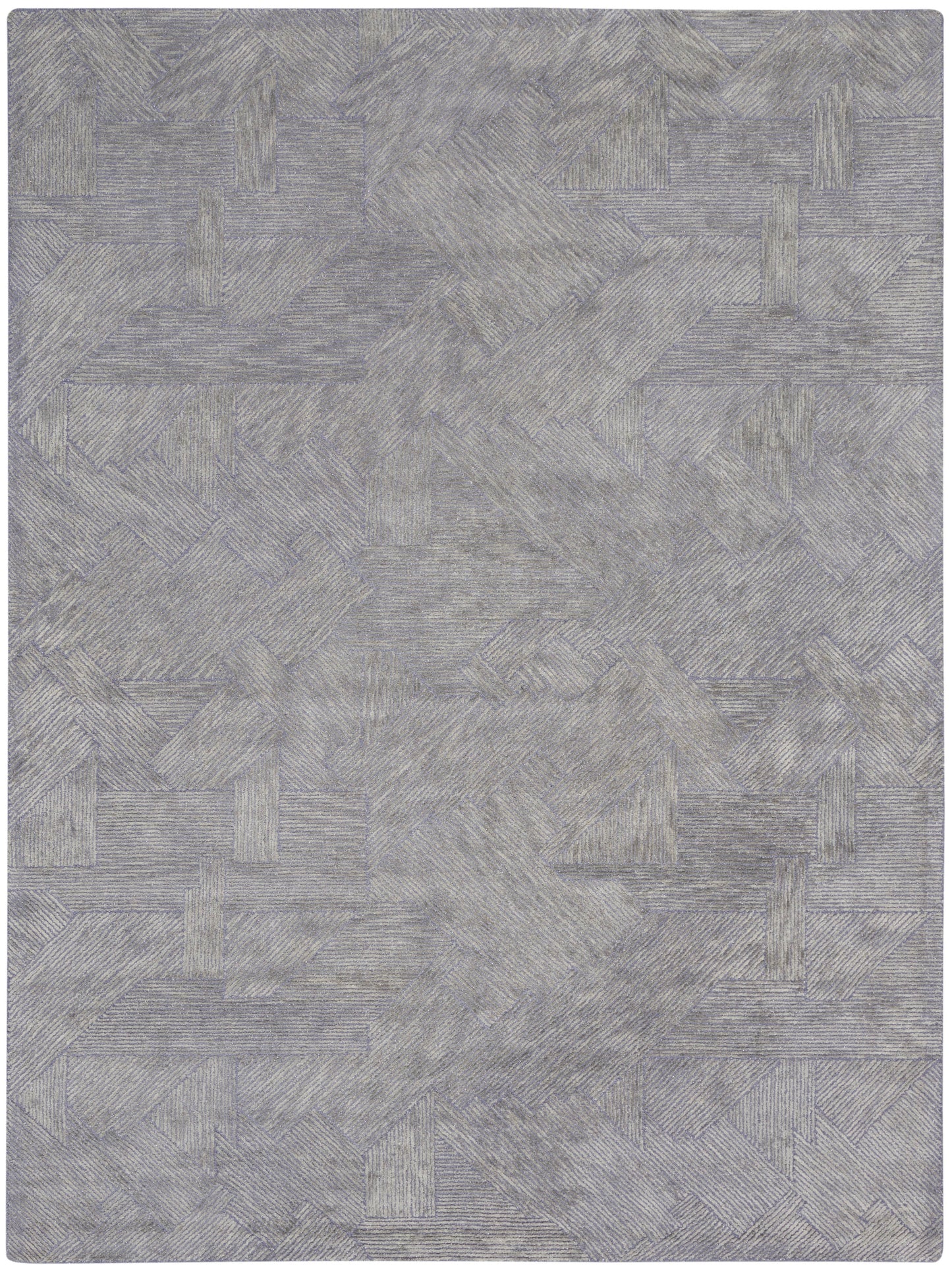 Grey-blue textured rug with a geometric patchwork of rectangular blocks and linear patterns.