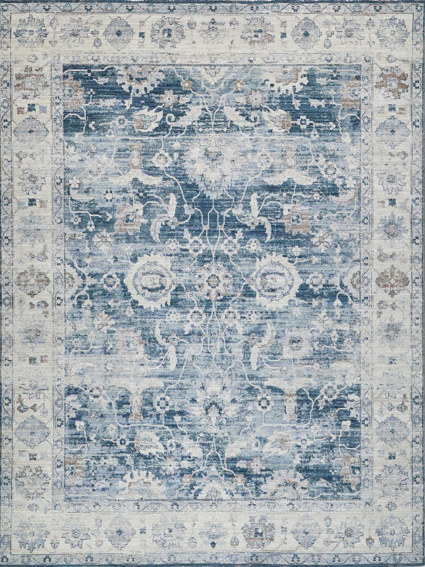Blue and ivory Persian-style area rug with distressed floral medallion and ornate border, plush pile for living spaces