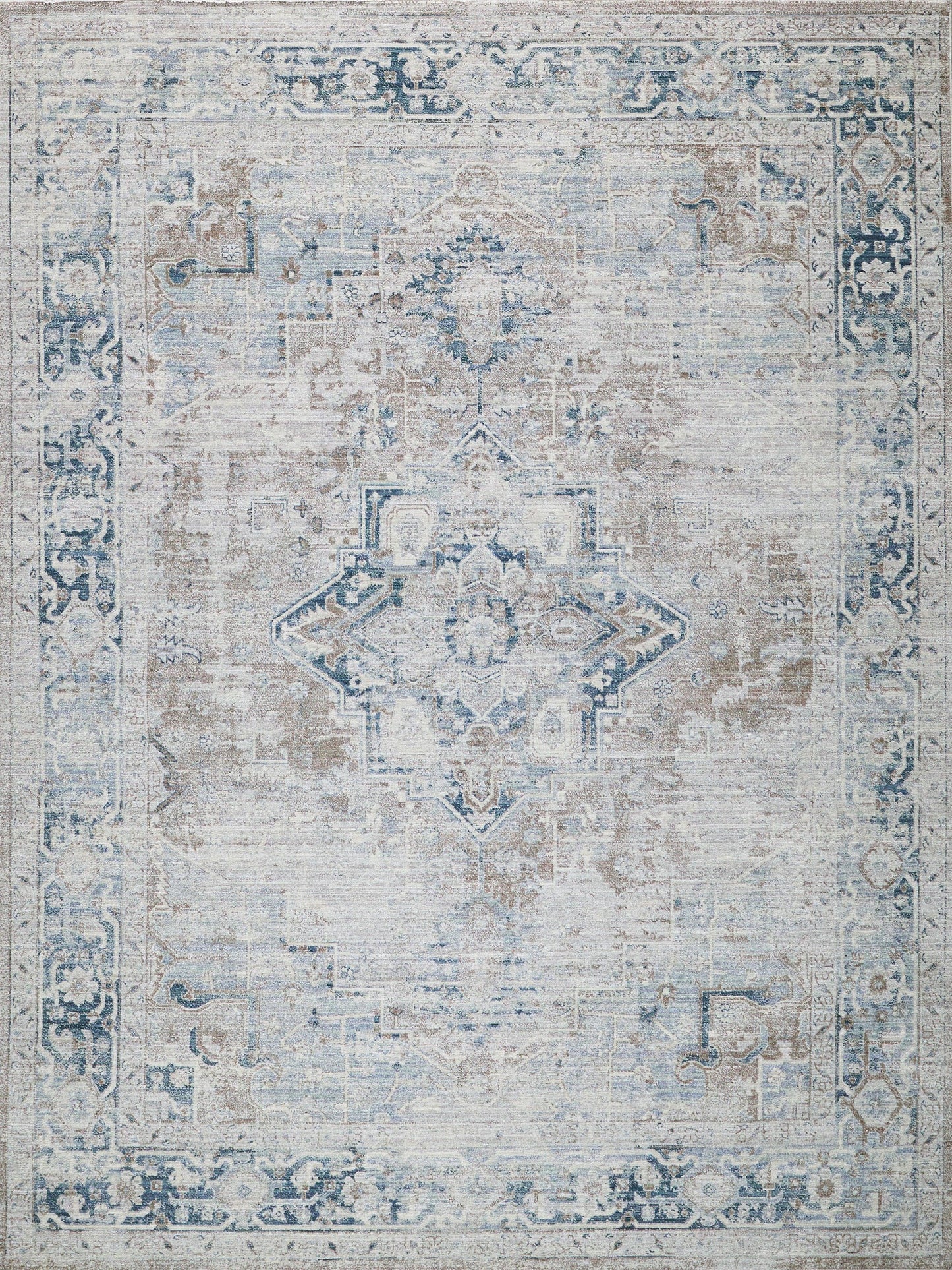 Distressed blue and ivory oriental rug with central medallion and ornate border; vintage decorative floor covering.