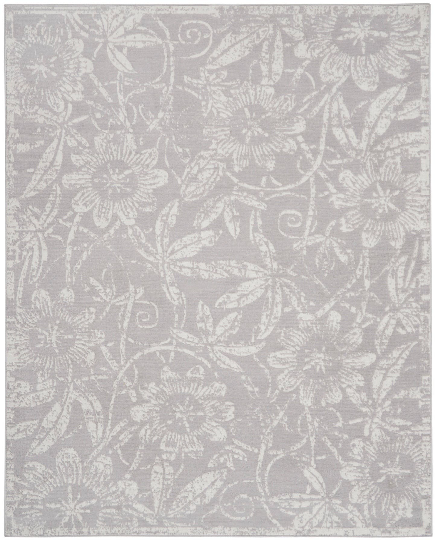 Light gray area rug featuring an allover white floral damask pattern and woven texture.
