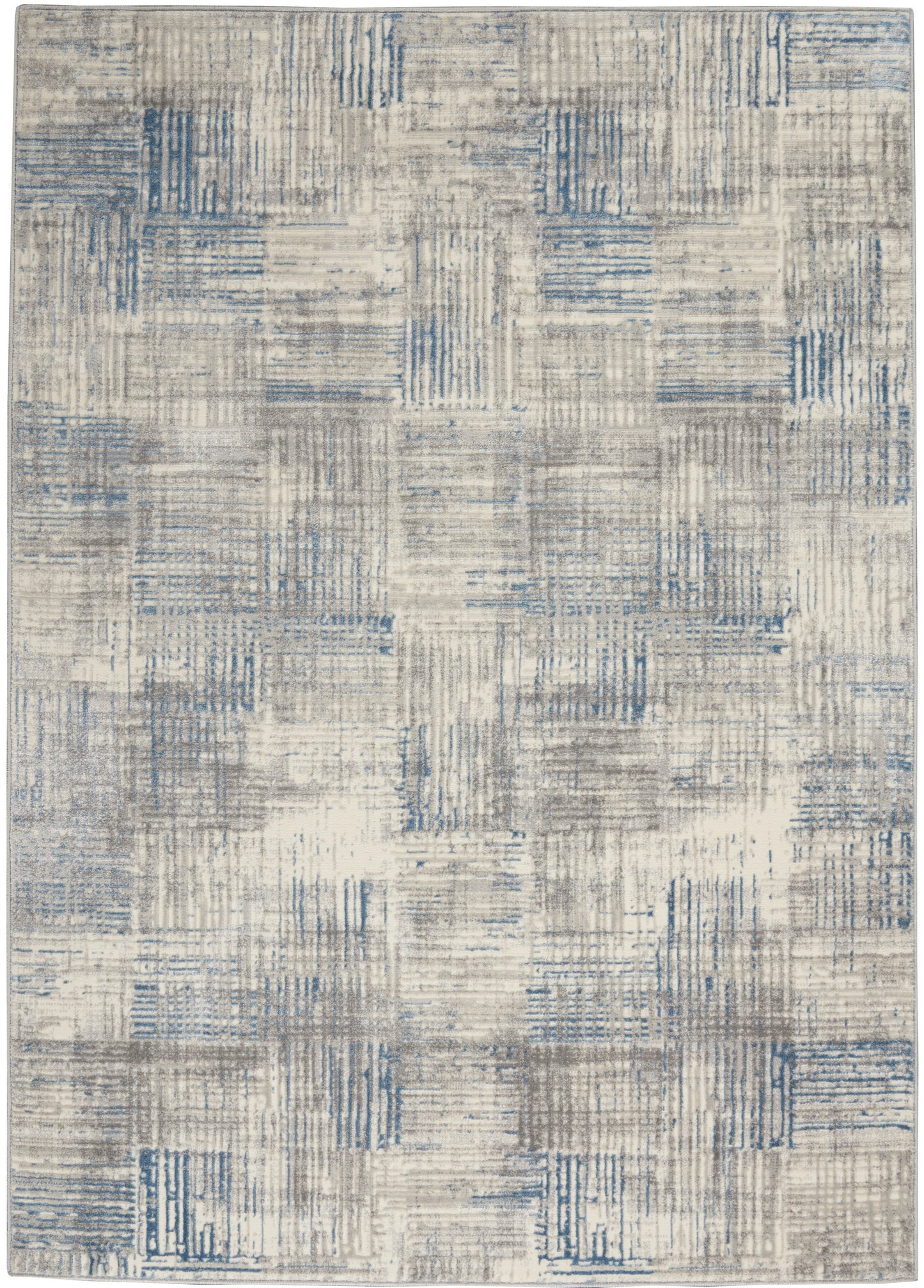 Modern area rug in beige and gray with blue patchwork squares; textured geometric pattern for living room.