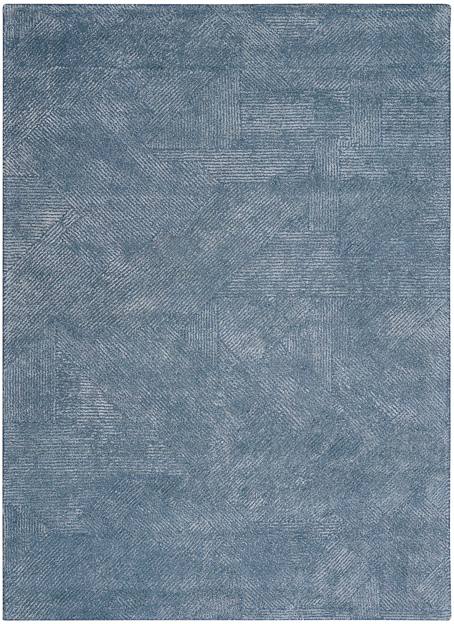 Blue textured area rug with patchwork linear patterns in denim tones; plush decorative floor covering.