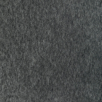 Close-up of charcoal gray wool texture, dense and soft for upholstery or crafts.