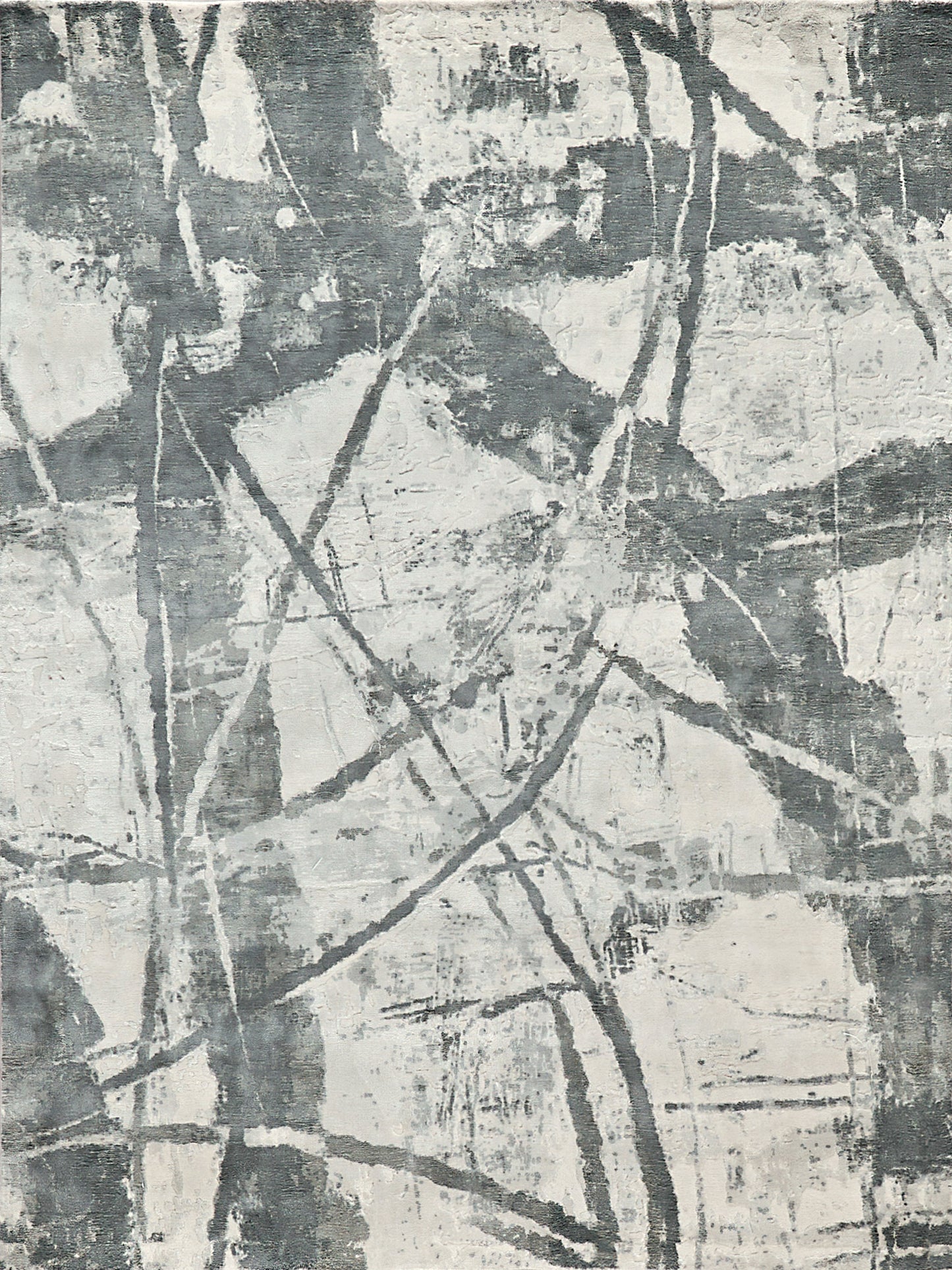 Abstract gray and white area rug featuring chaotic linear patterns; soft texture ideal for modern or minimalist decor.