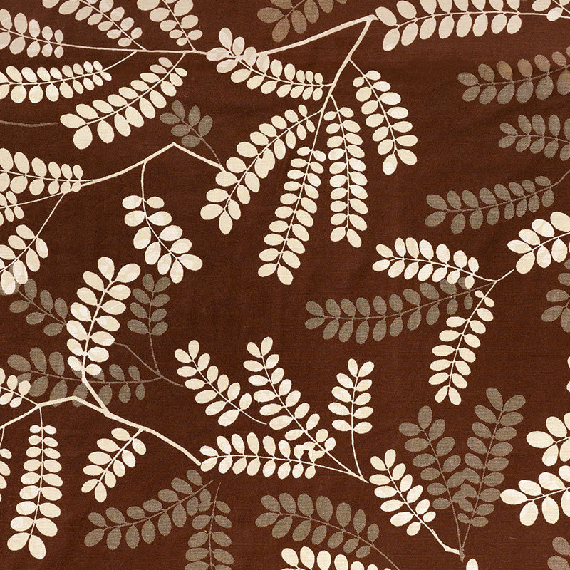 Brown fabric with white and gray fern-like leaf pattern, botanical print.