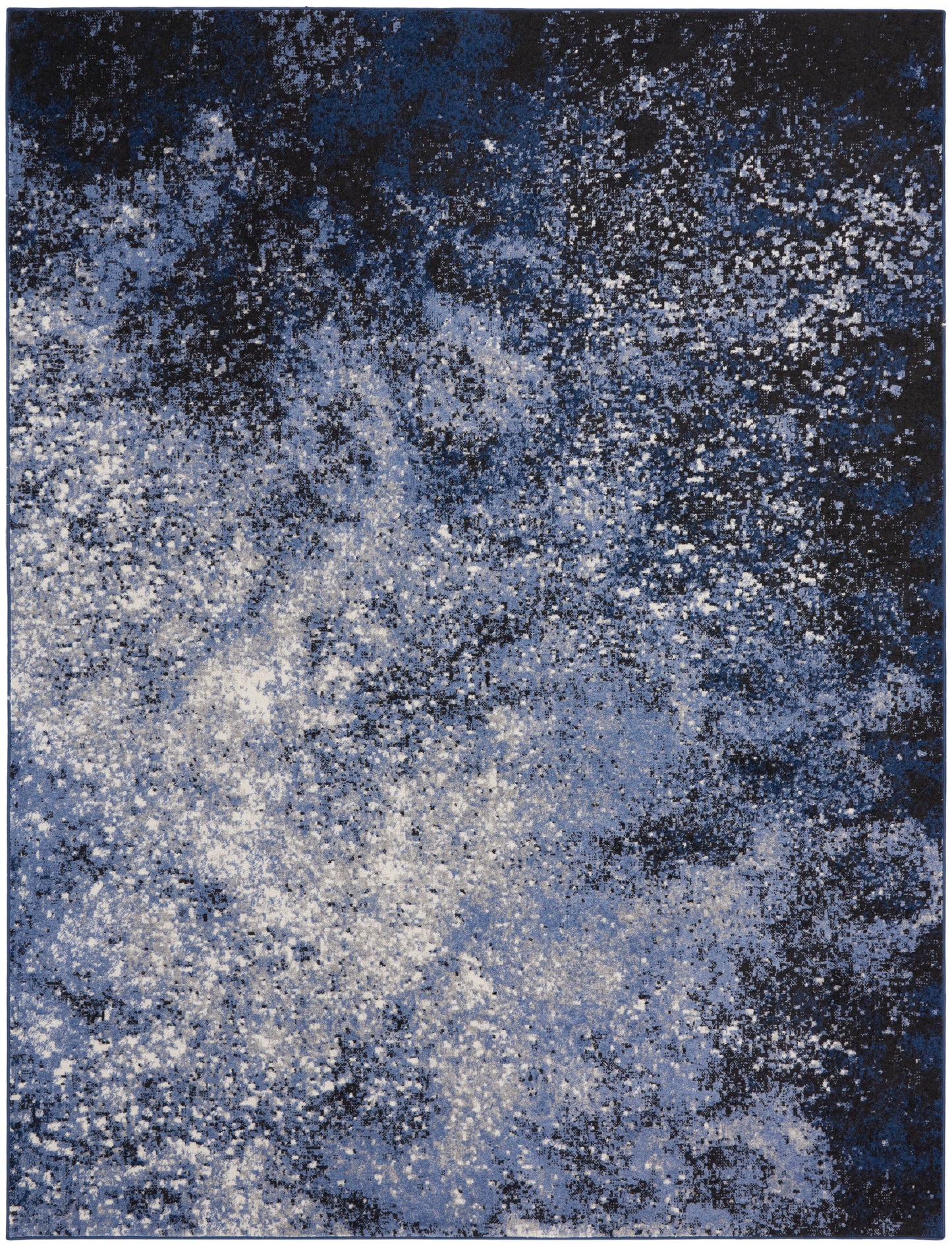 Rectangular abstract blue rug with navy, cobalt & white speckled pattern.