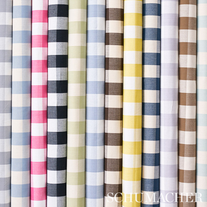 Cotton check fabric rolls in mocha and cream tones; mocha-and-cream check pattern on vertical bolts