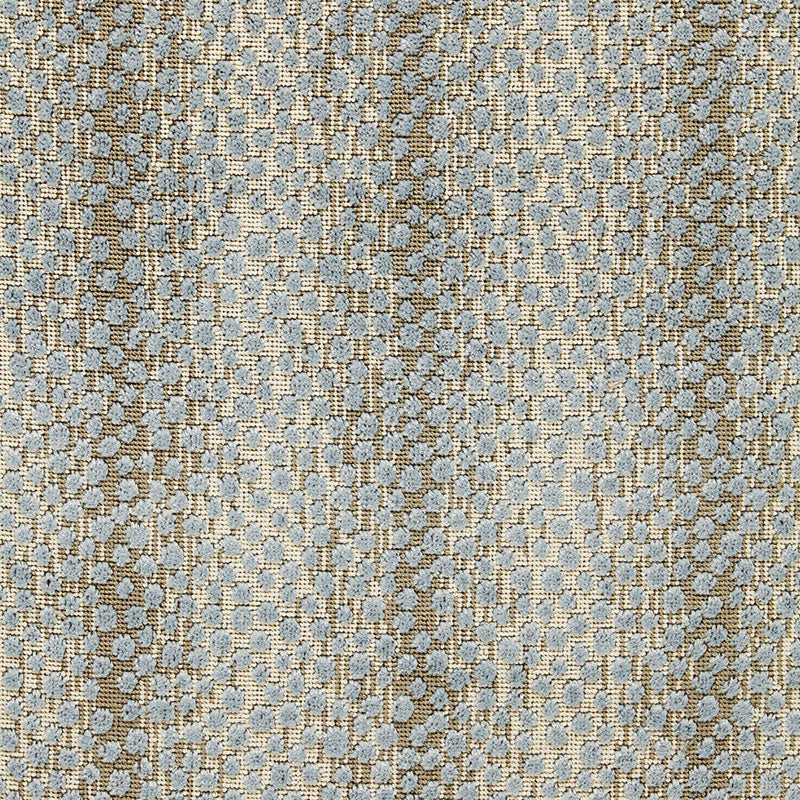 Tweed-like woven fabric in beige with pale blue dots; textured upholstery or garment material.