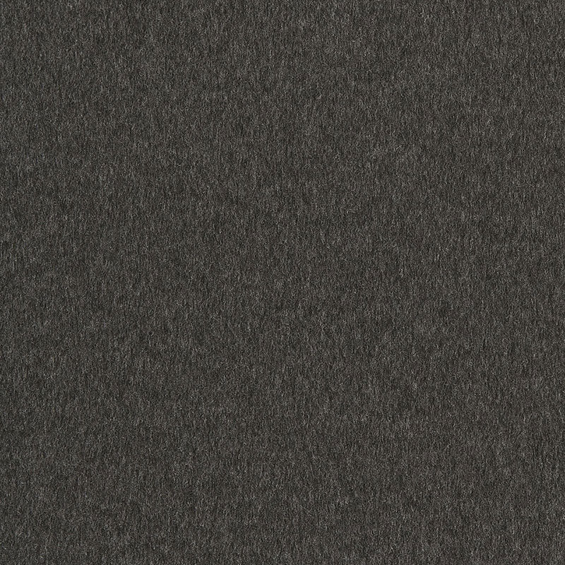 Close-up of dark charcoal textured fabric with a matte, suede-like finish.