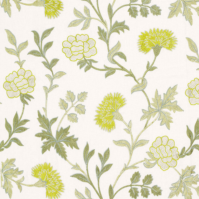 Floral botanical fabric print with pale ivory background, yellow-green blossoms and leafy green stems.
