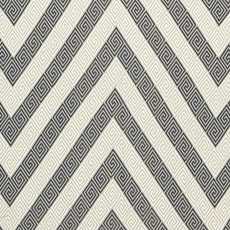 Navy and cream chevron with inner Greek-key meander on a woven fabric; bold geometric textile.