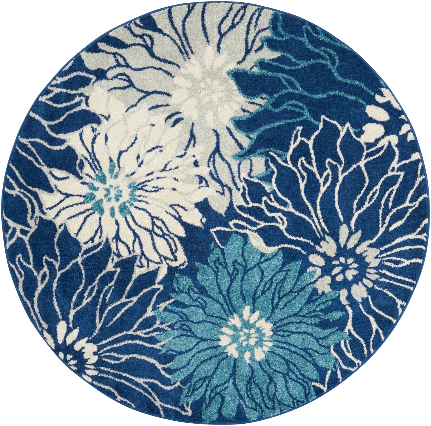 Round blue rug with white and teal floral motifs in an abstract blooming pattern.