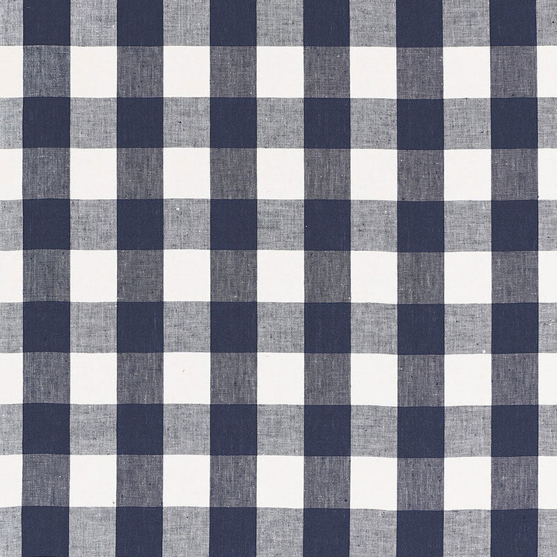 Navy blue and white gingham check fabric; cotton textile for shirts or table linens.