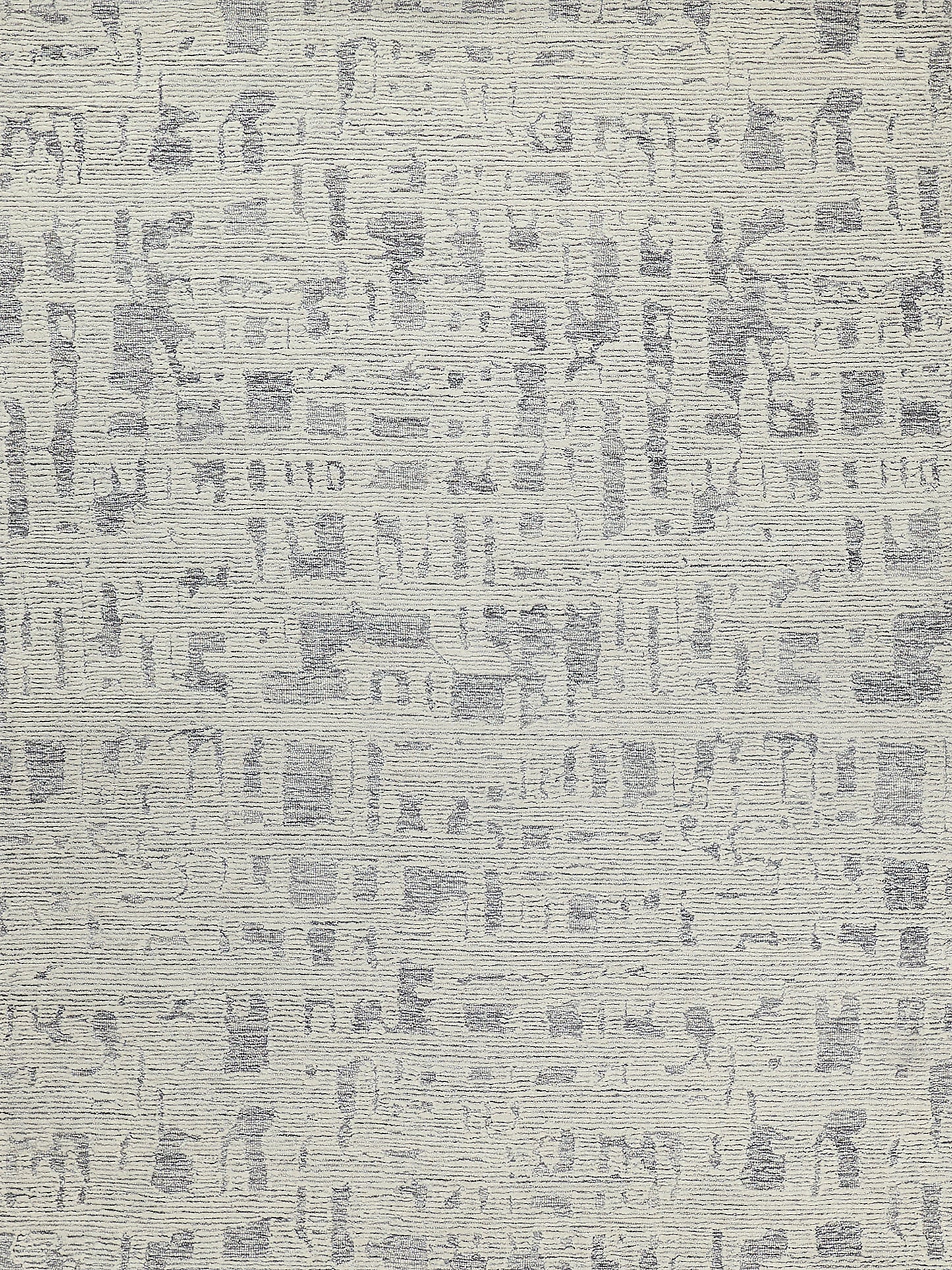 Hand-tufted rectangle rug in soft cream with abstract gray patterns.