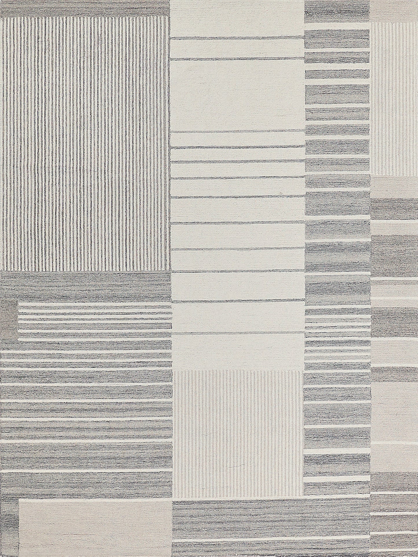 Geometric rug in grey and cream with stripes and solid blocks; soft texture.