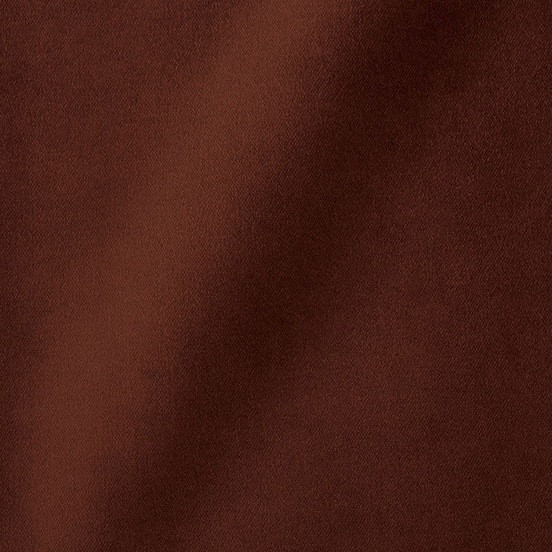 Close-up of warm brown fabric with a soft matte finish and a diagonal fold.