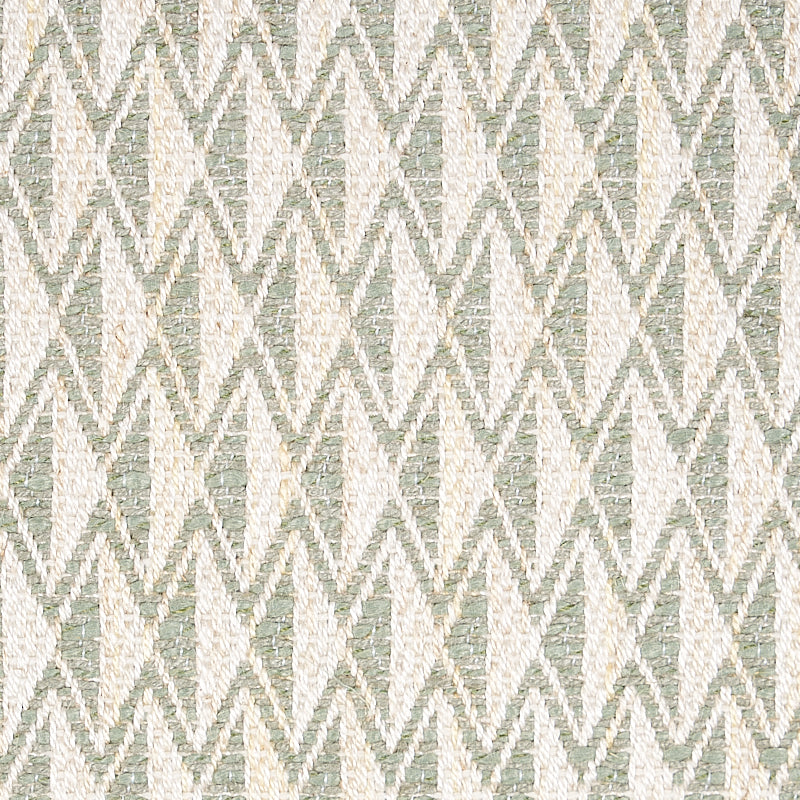 Woven fabric in cream and sage green with a repeating diamond zigzag pattern; textured geometric upholstery.