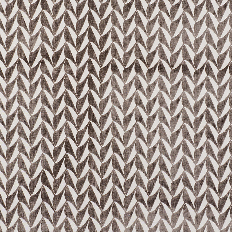 Brown chevron pattern with leaf-shaped motifs on beige background, textile texture.