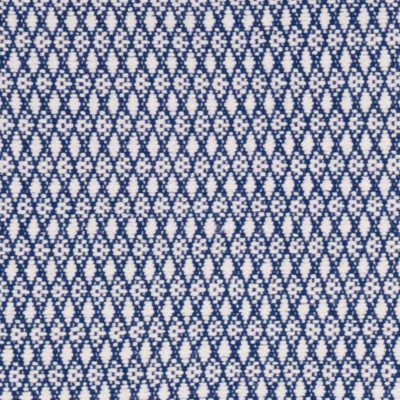 Navy blue woven fabric with tiny white diamond motifs; geometric pattern suitable for shirts or dresses.